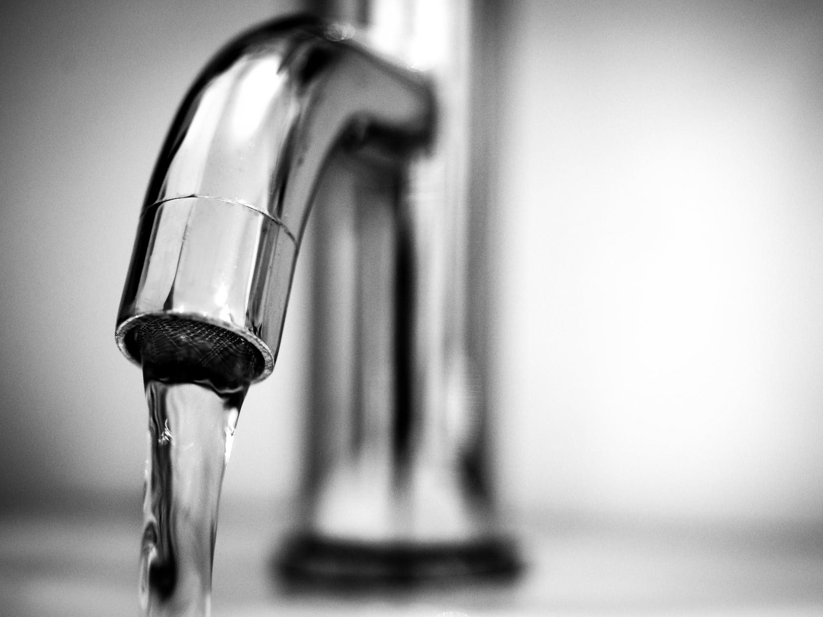 Macro Photography of a Stainless Steel Faucet